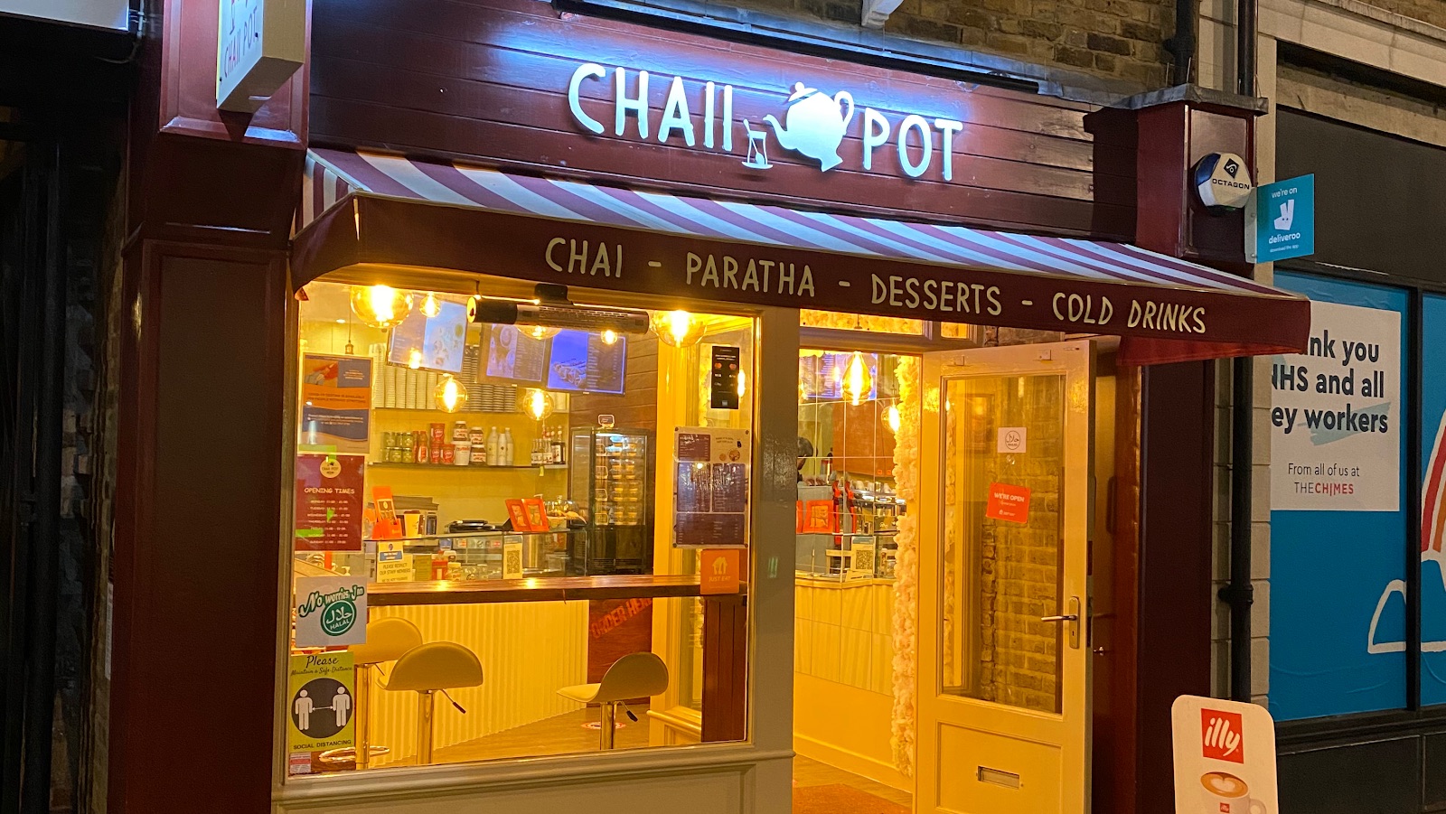 The lit Chaii Pot shopfront at night