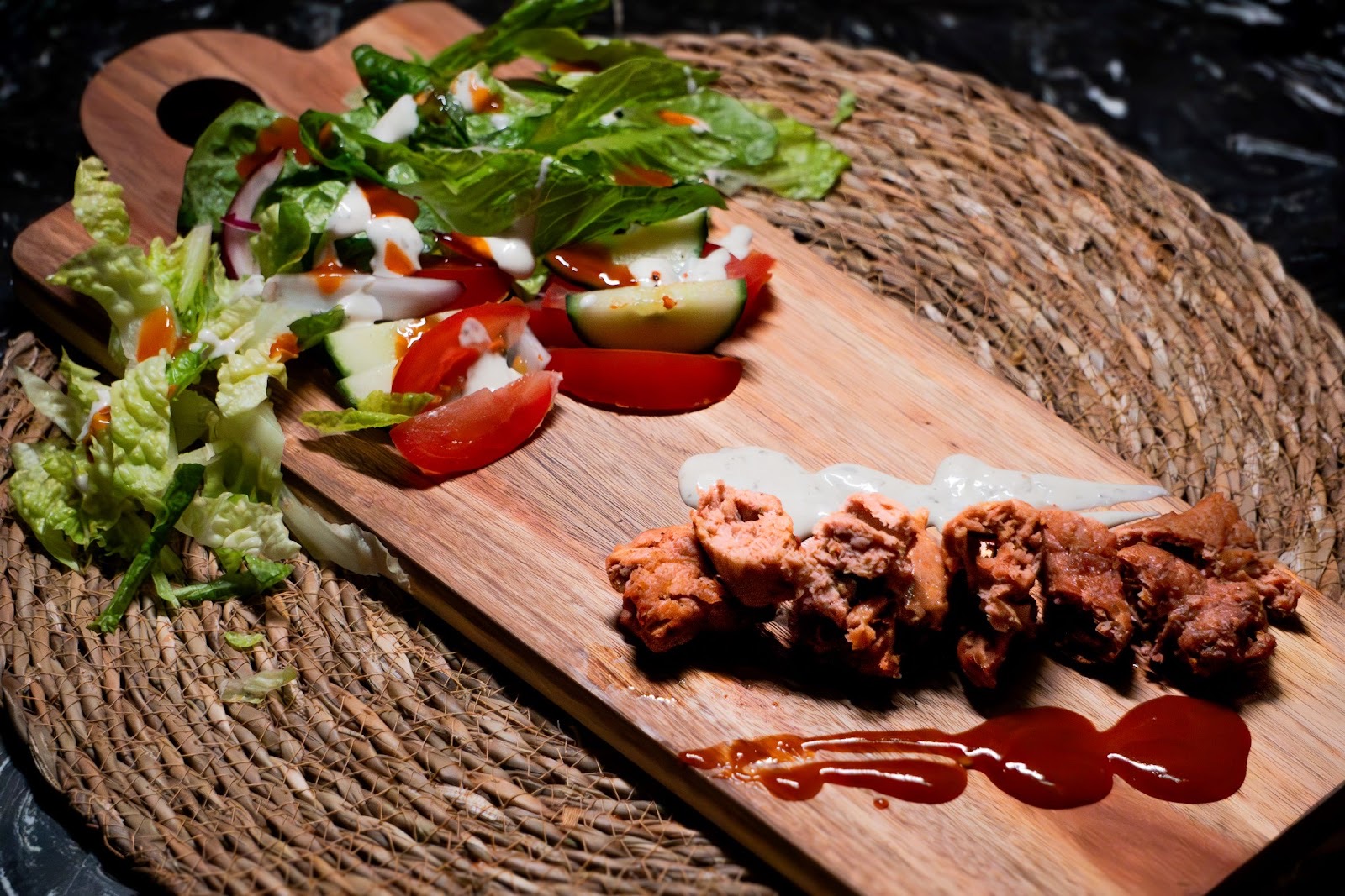 A grilled kebab and salad board at Chaii Pot